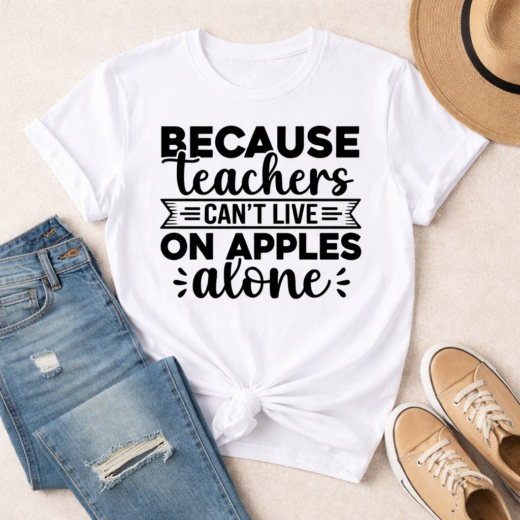 White T-shirt with “Because teachers can’t live on apples alone” SVG design in black, flat lay with jeans, shoes, and hat on neutral background – Funny Teacher SVG Quotes