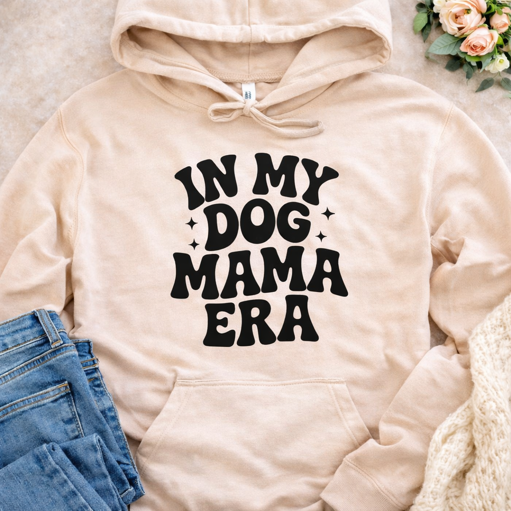In My Dog Mama Era SVG quote design on beige hoodie mockup for Cricut and Silhouette DIY projects