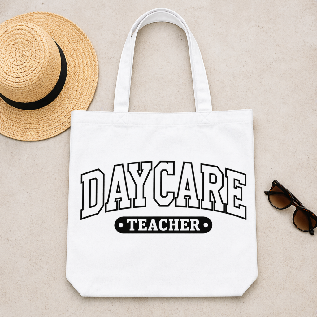 White tote bag featuring Daycare Teacher SVG in bold clean lettering styled with straw hat and sunglasses on neutral background