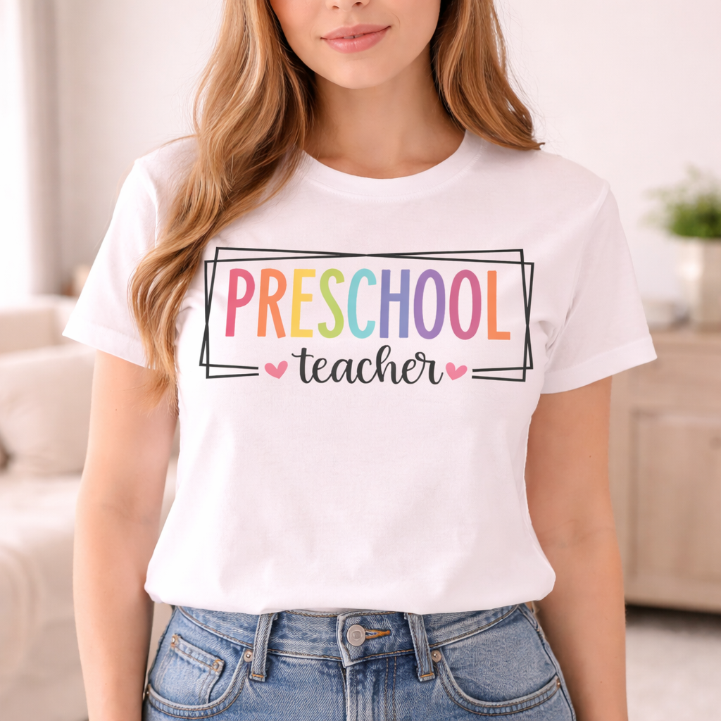 Woman wearing white t shirt with Preschool Teacher SVG in colorful letters framed by simple lines and small hearts in casual style
